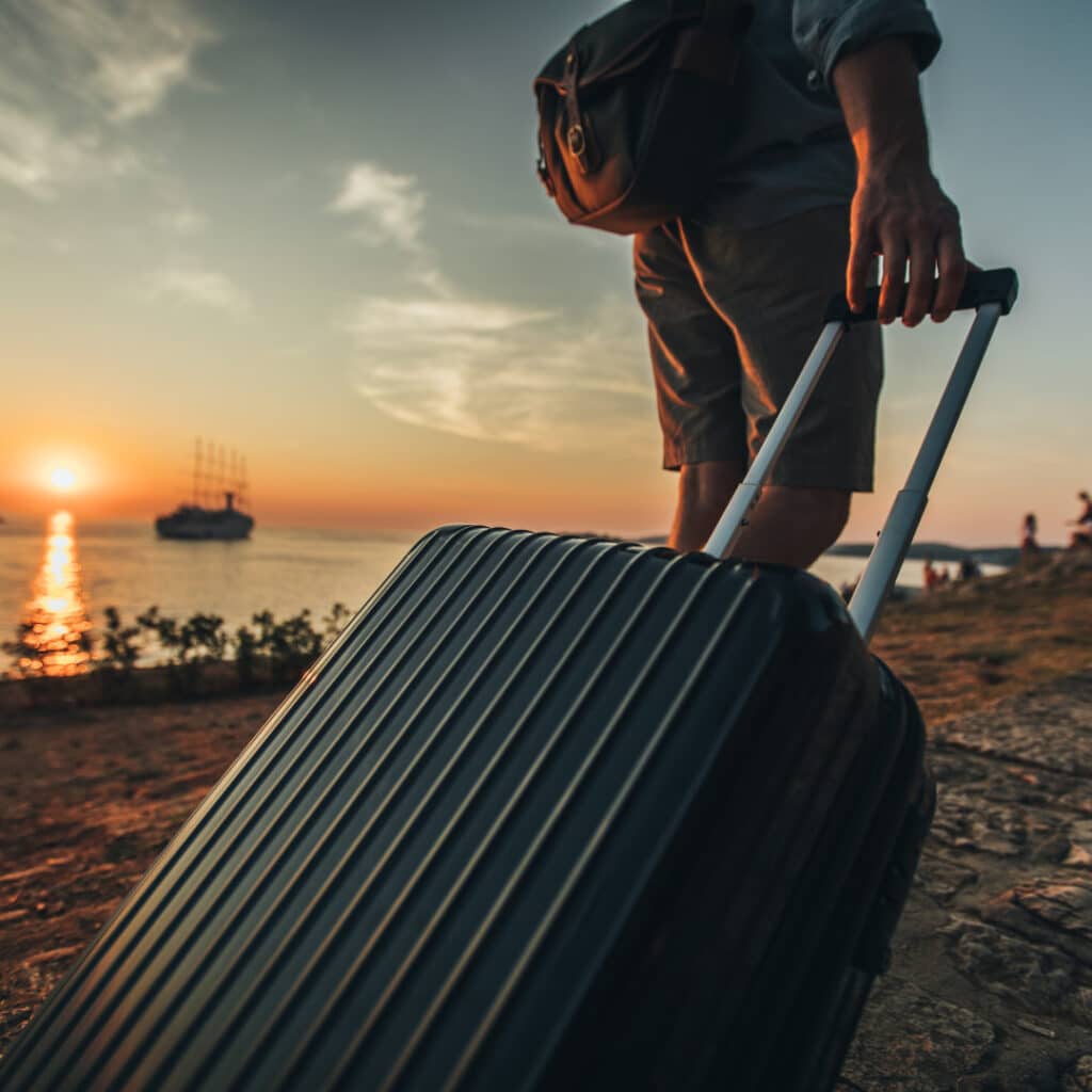 A man dragging a suitcase
